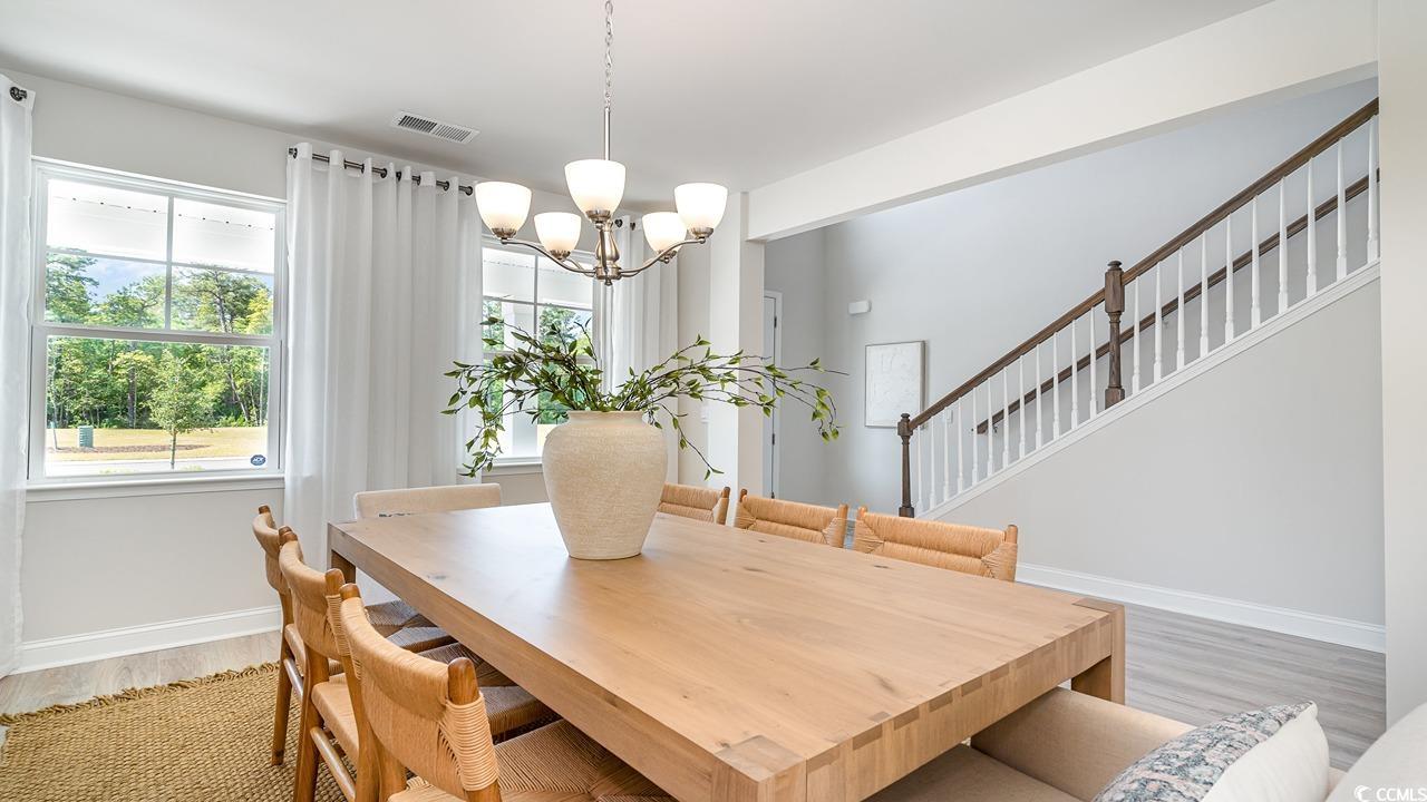 828 Hibernation Way Conway, SC 29526 - Photo 8 of 30 Dining area with hardwood / wood-style flooring an