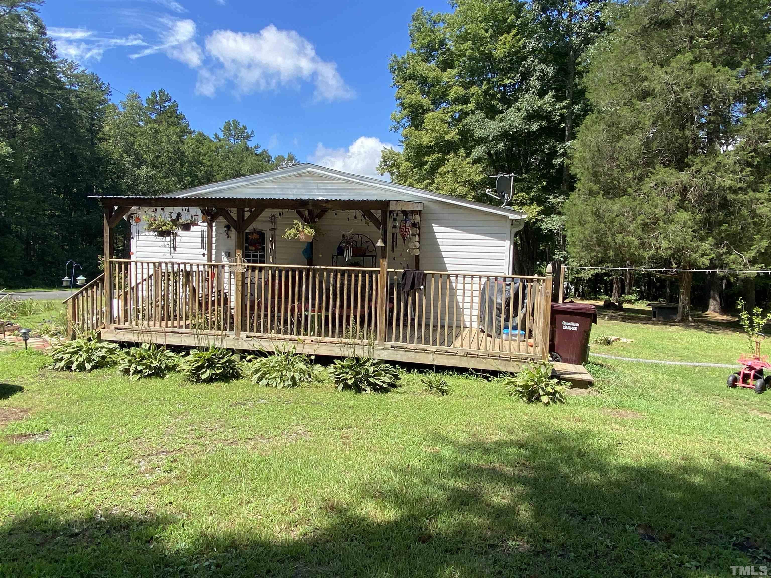 319 Cousin Road Rougemont, NC 27572 - Photo 2 of 17 a view of a chair and table in the garden