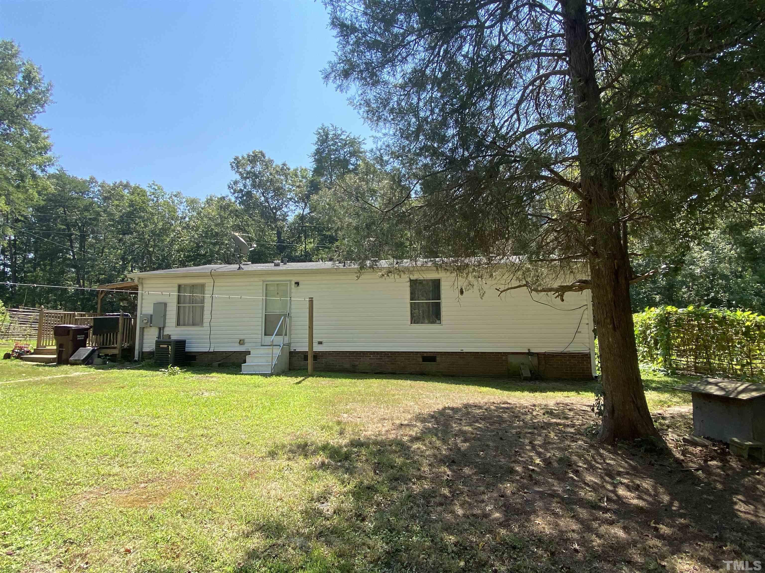 319 Cousin Road Rougemont, NC 27572 - Photo 12 of 17 a view of a house with swimming pool in front of a yard