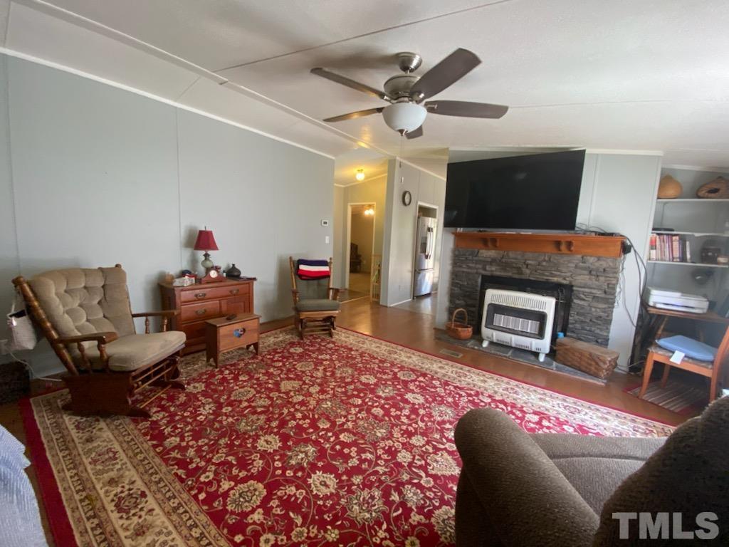 319 Cousin Road Rougemont, NC 27572 - Photo 4 of 17 a living room with furniture and a fireplace