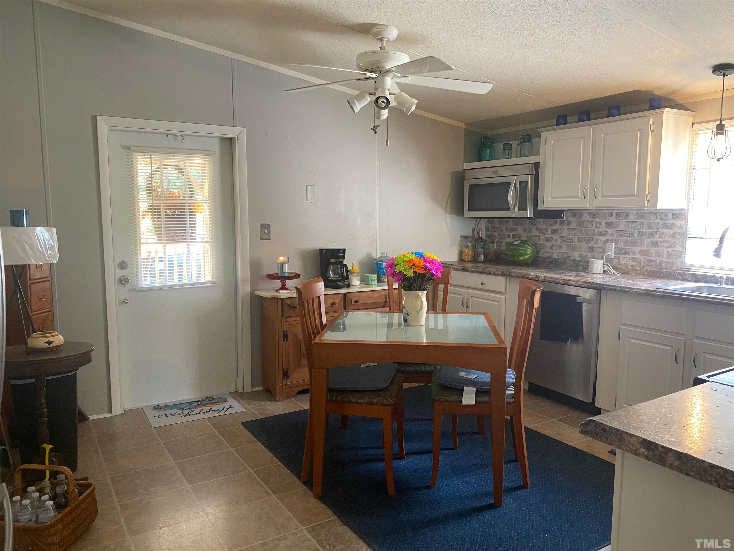 319 Cousin Road Rougemont, NC 27572 - Photo 7 of 17 a view of a dining room with furniture and wooden floor