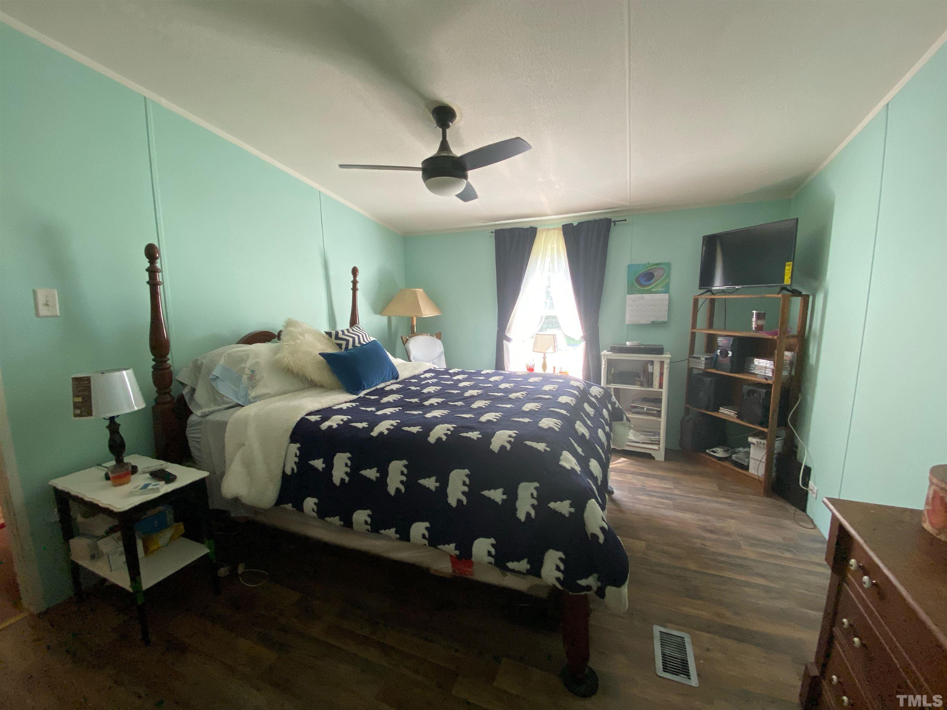 319 Cousin Road Rougemont, NC 27572 - Photo 10 of 17 a bedroom with a bed window and a table