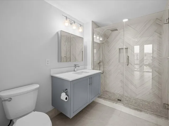 a view of a bedroom with washer and dryer
