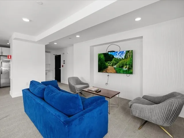 a kitchen with stainless steel appliances a refrigerator sink and cabinets