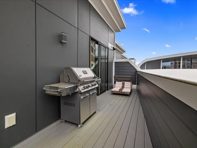 a spacious bedroom with a large bed and a couch