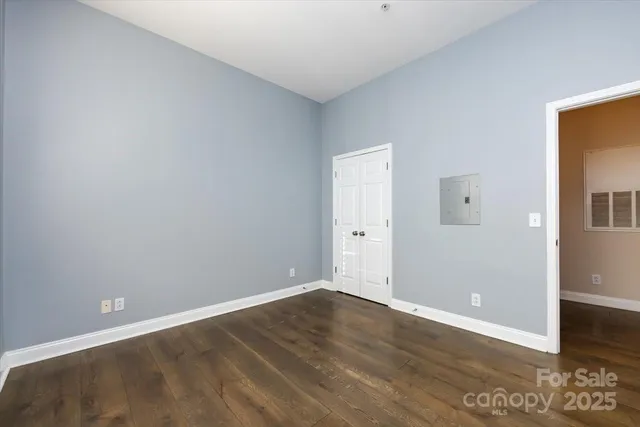 a bathroom with a sink vanity mirror and toilet