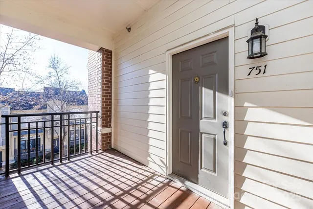 a view of a door and wooden floor