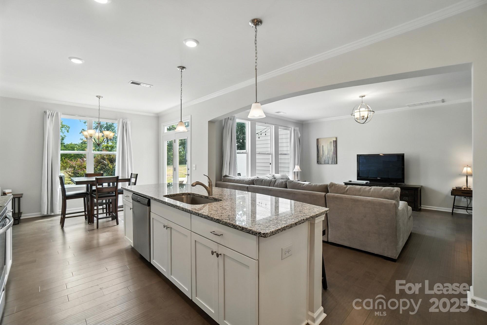 805 River Park Road Belmont, NC 28012 - Photo 12 of 42 a kitchen with sink stove and chairs