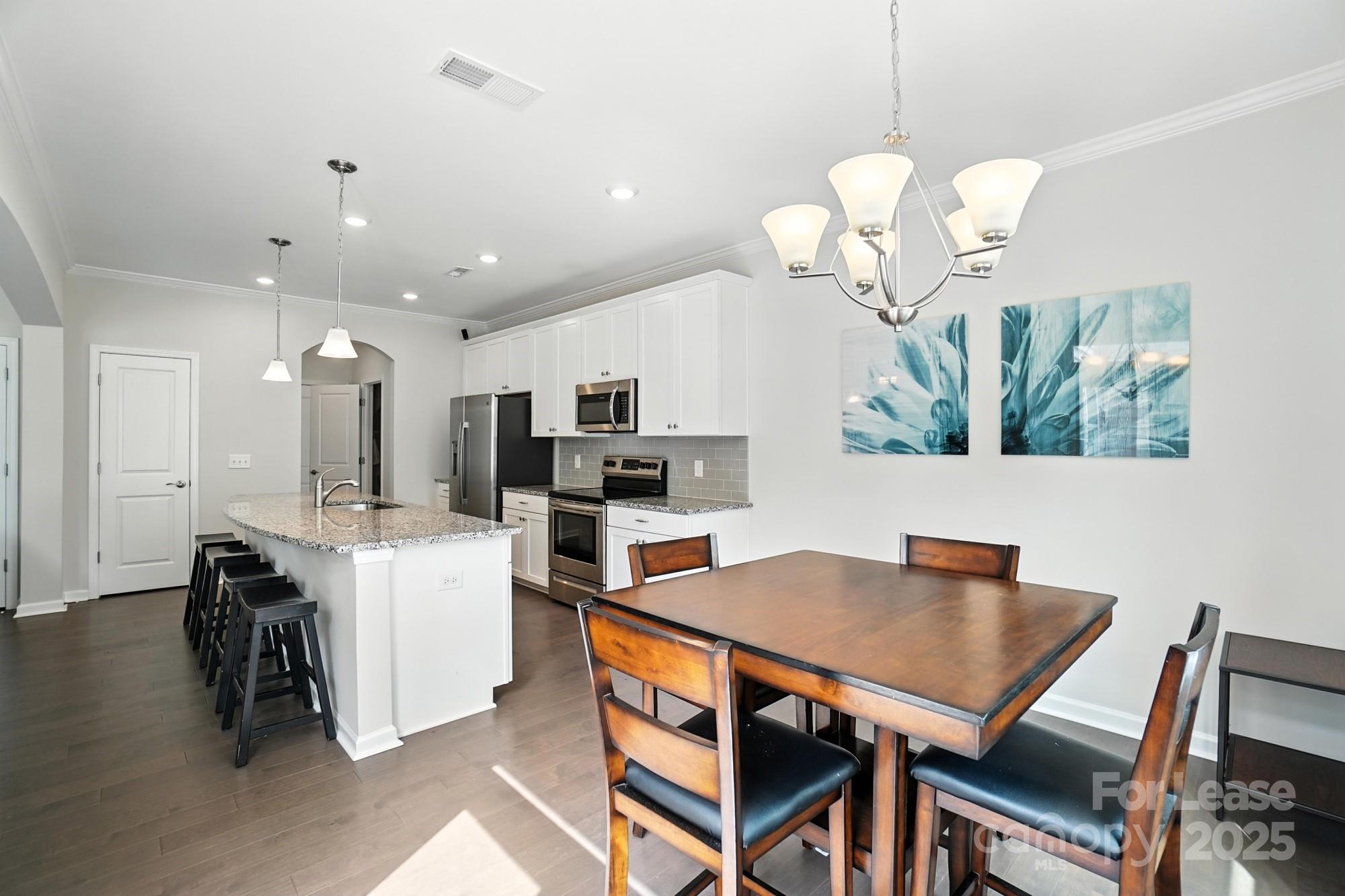 805 River Park Road Belmont, NC 28012 - Photo 14 of 42 a dining room filled chandelier and kitchen view
