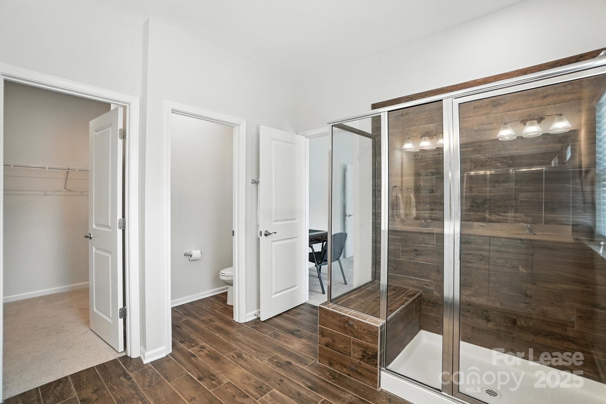 805 River Park Road Belmont, NC 28012 - Photo 26 of 42 a bathroom with a glass shower door