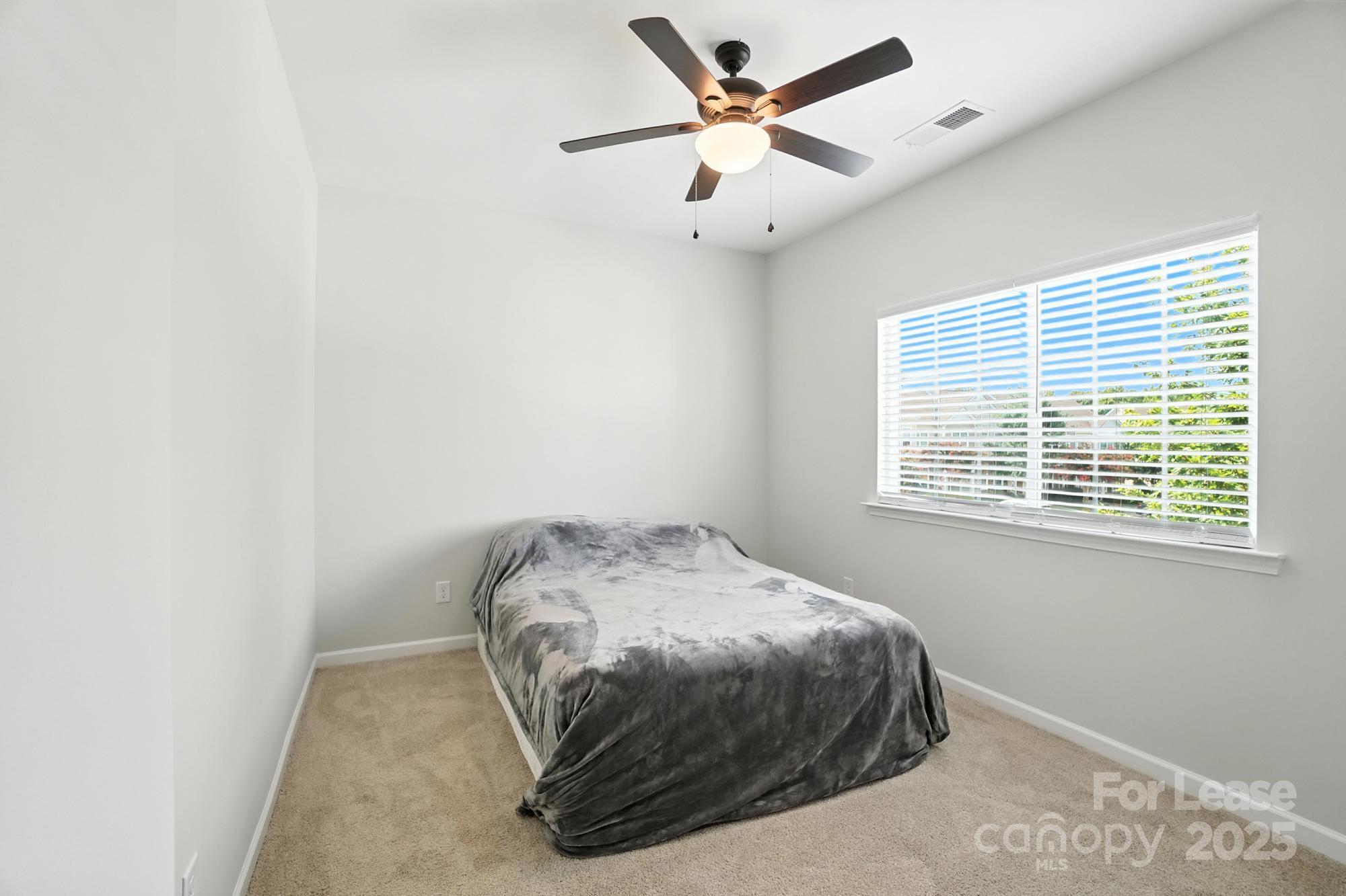 805 River Park Road Belmont, NC 28012 - Photo 35 of 42 a bedroom with a bed and a window
