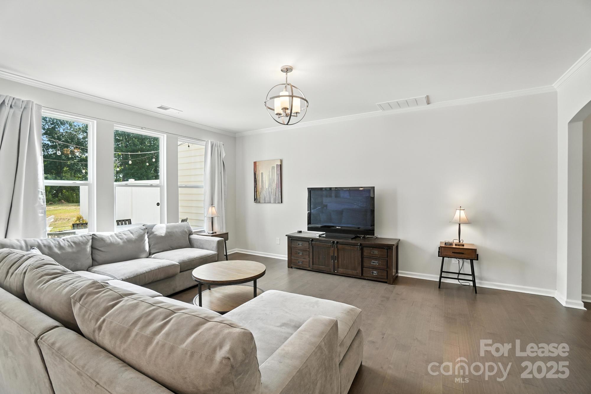 805 River Park Road Belmont, NC 28012 - Photo 6 of 42 a living room with furniture and a flat screen tv