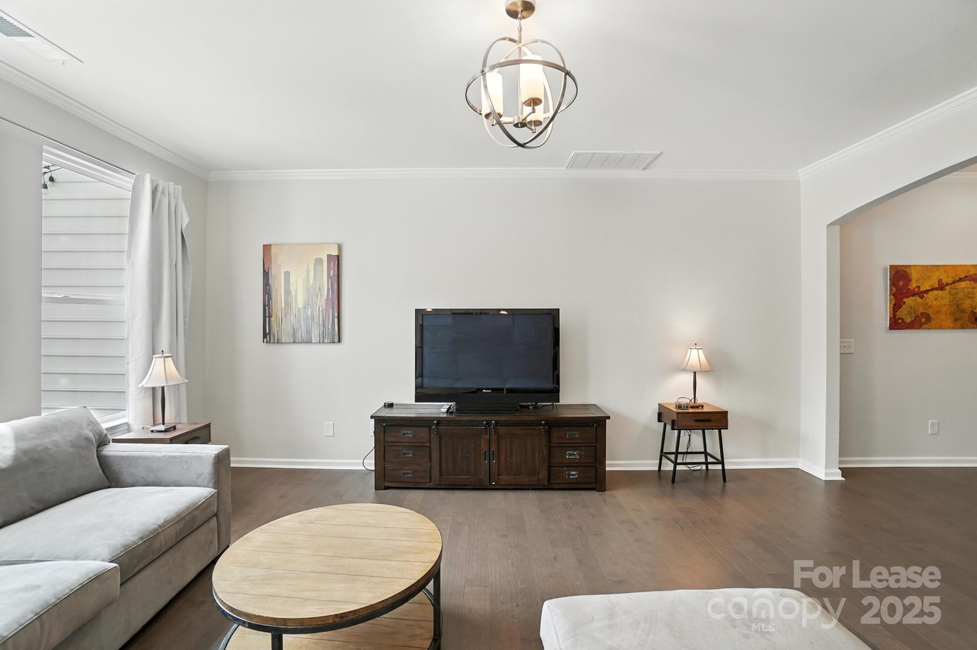 805 River Park Road Belmont, NC 28012 - Photo 7 of 42 a living room with furniture and a flat screen tv