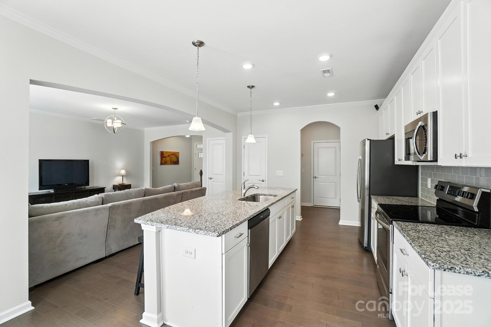 805 River Park Road Belmont, NC 28012 - Photo 9 of 42 a large kitchen with a center island and stainless steel appliances