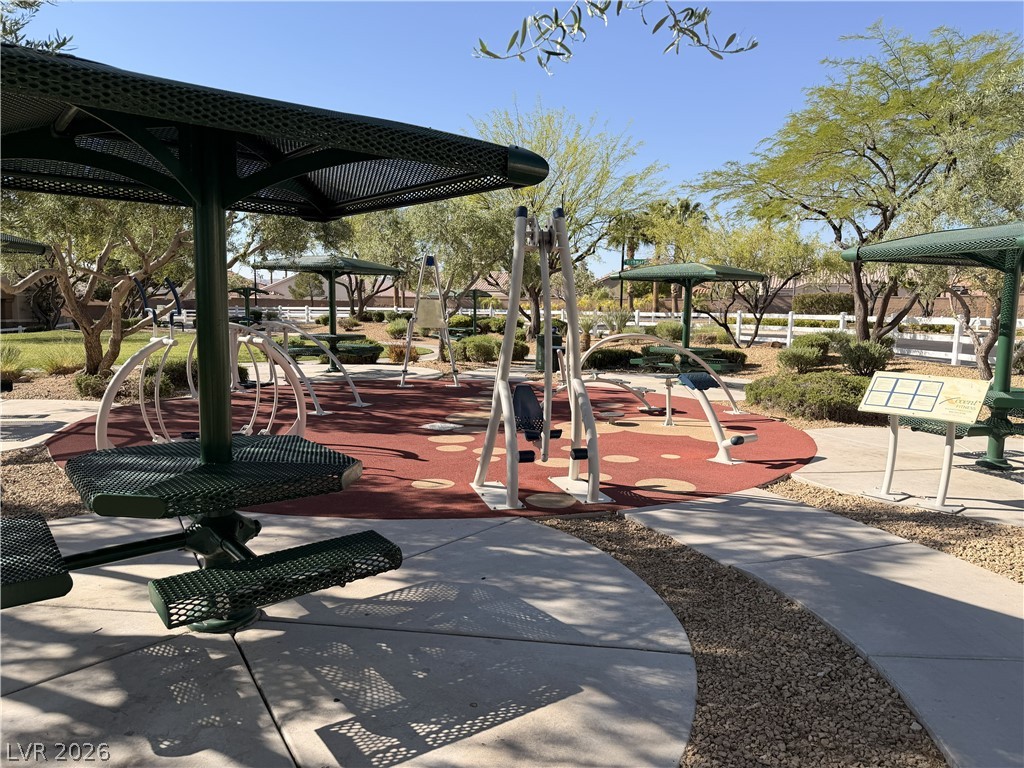 8909 Houston Ridge Avenue Las Vegas, NV 89178 - Photo 47 of 50 An inviting outdoor exercise area offers recreation amidst landscaped greenery and paved walkways.