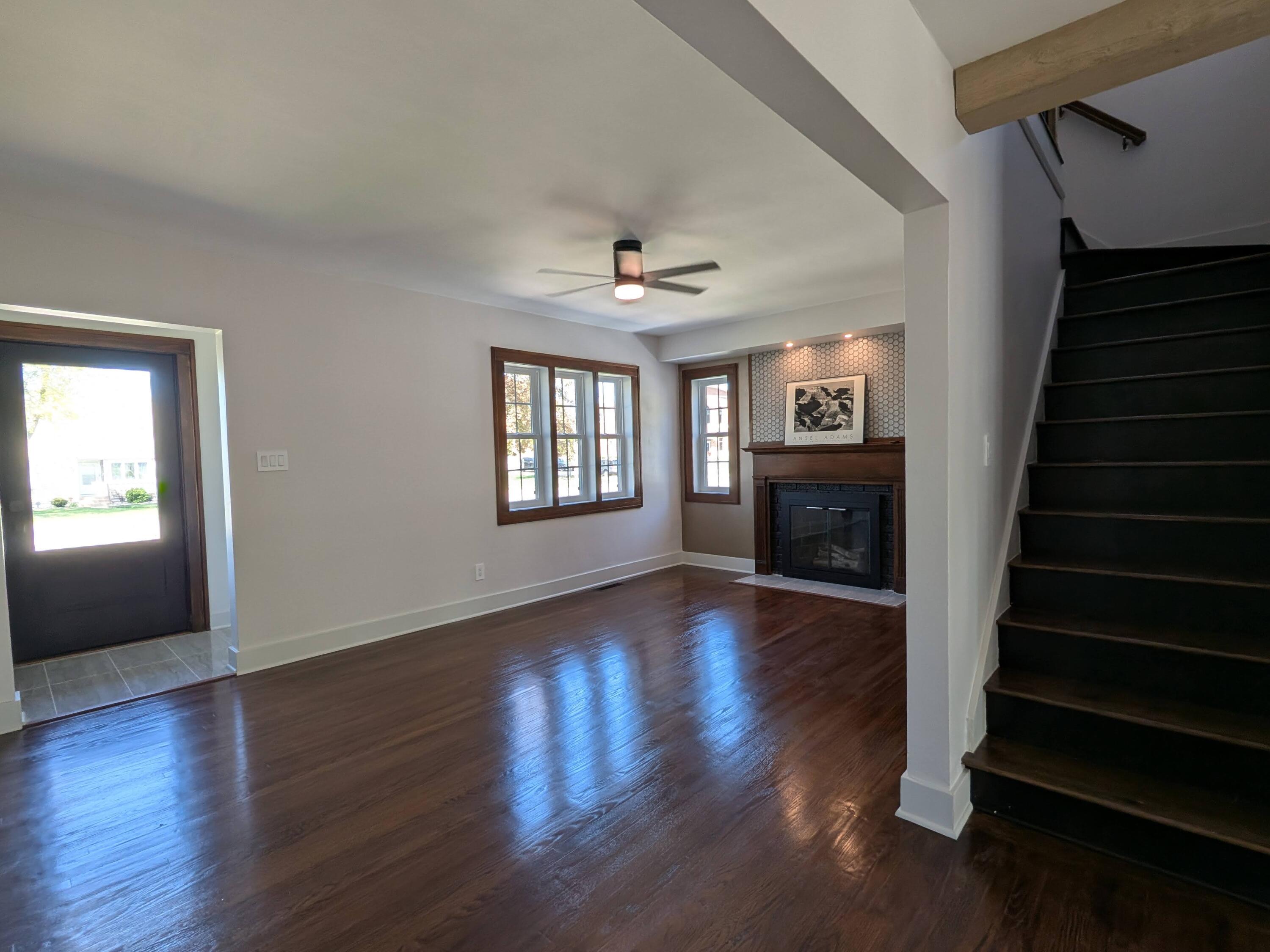 3298 Ridge Road Highland, IN 46322 - Photo 17 of 39 wooden floor in an empty room with a fireplace