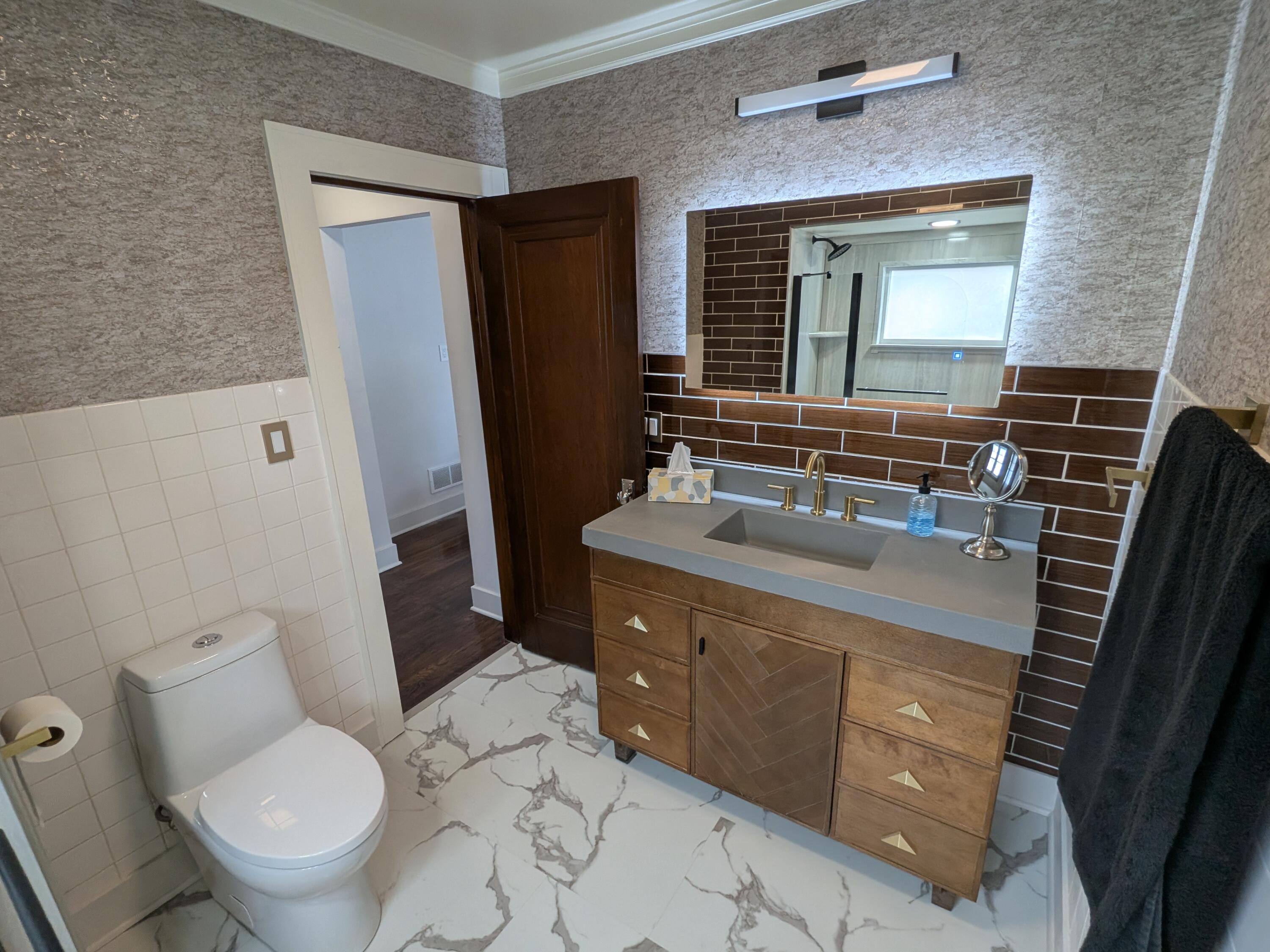 3298 Ridge Road Highland, IN 46322 - Photo 21 of 39 a bathroom with a granite countertop toilet sink and mirror
