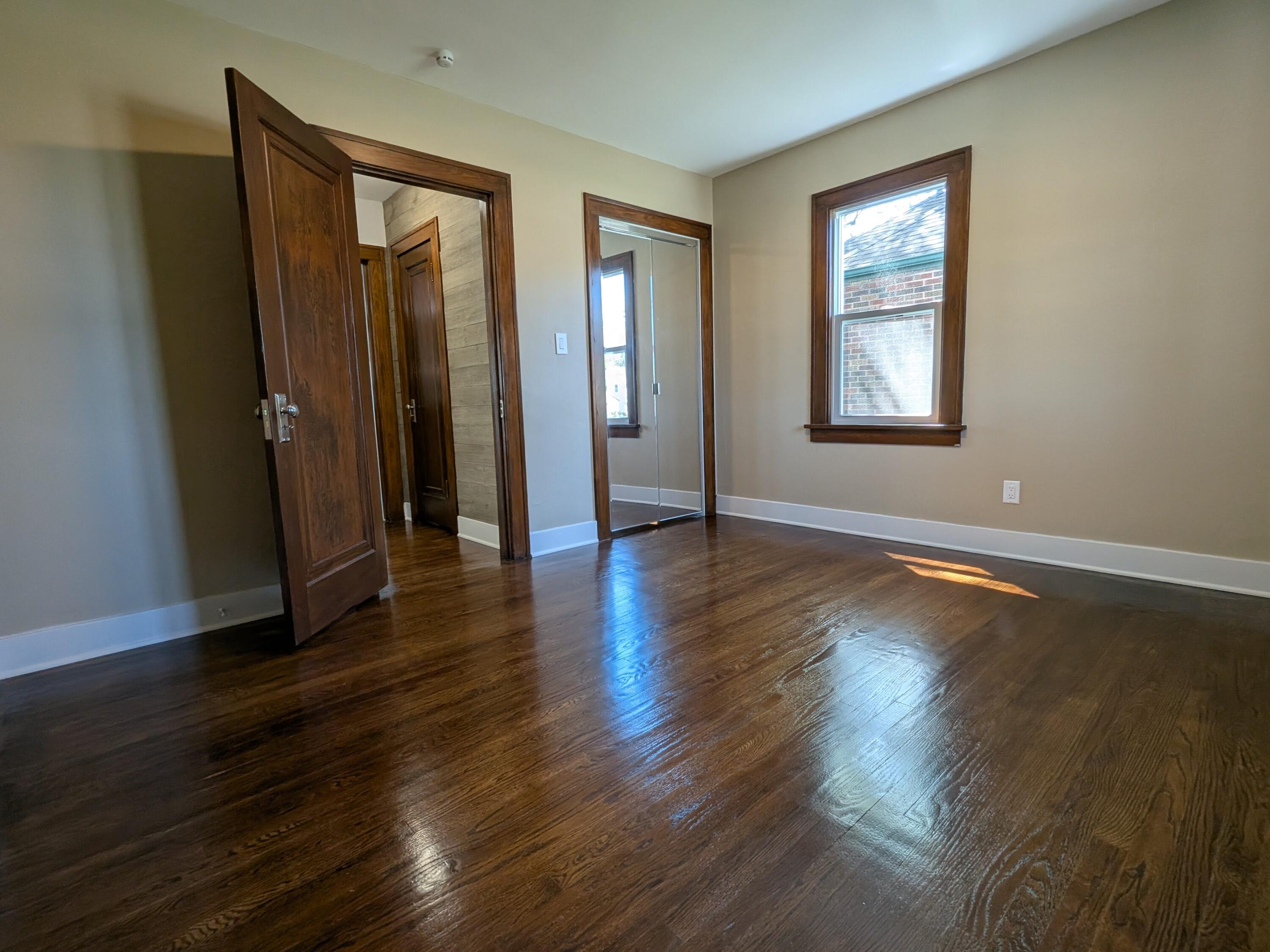 3298 Ridge Road Highland, IN 46322 - Photo 22 of 39 an empty room with wooden floor and windows