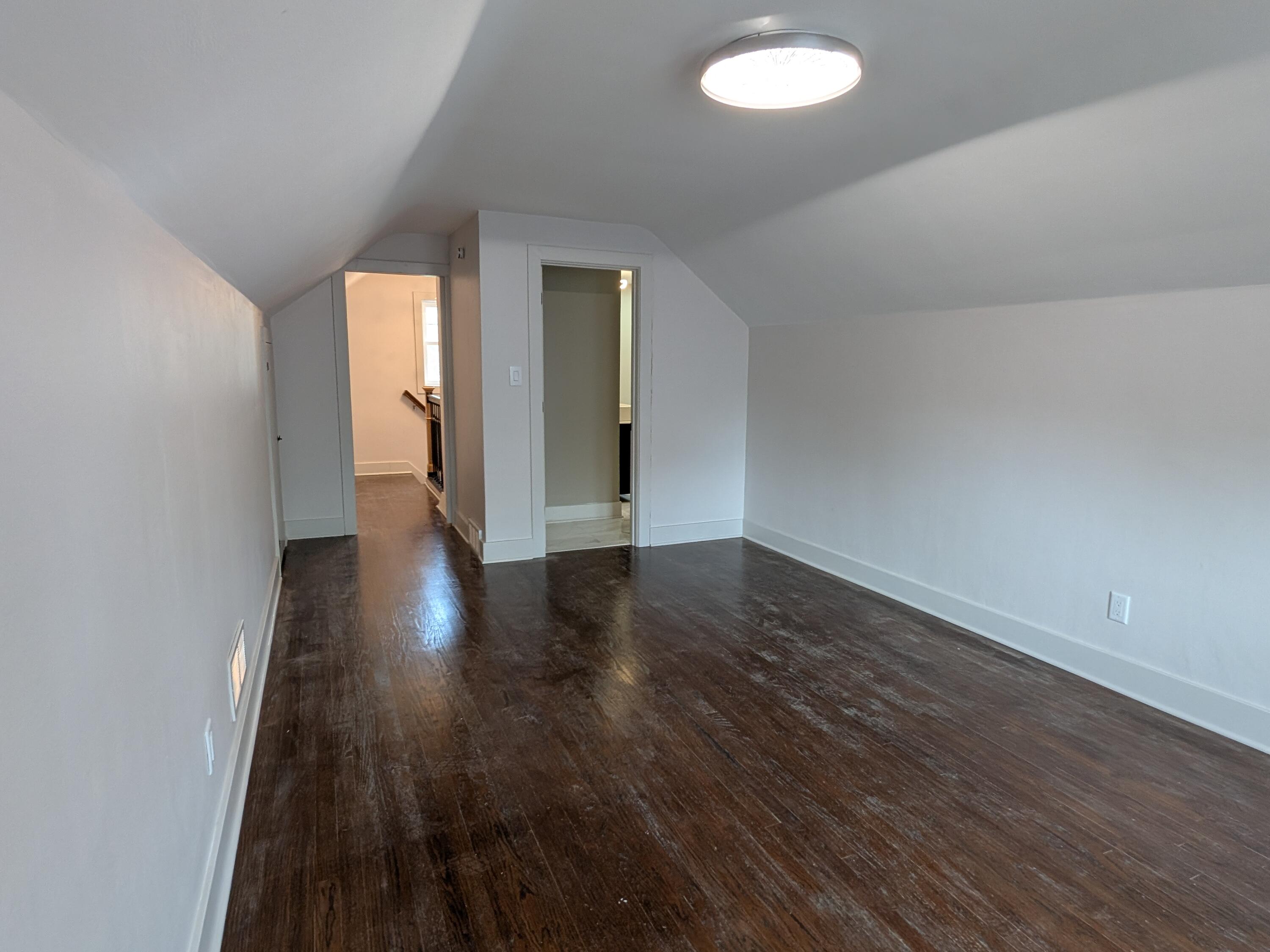 3298 Ridge Road Highland, IN 46322 - Photo 25 of 39 an empty room with wooden floor and windows