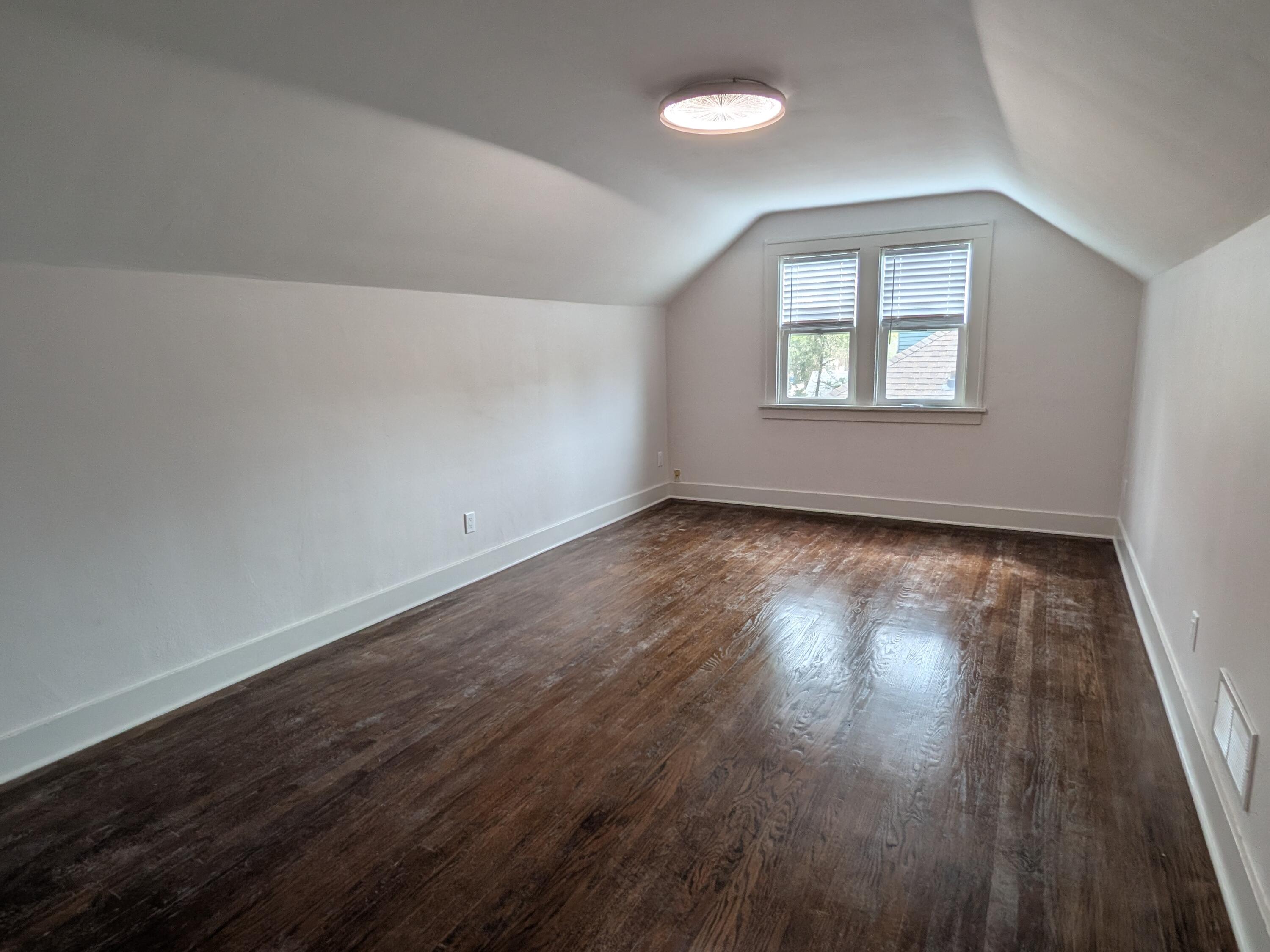 3298 Ridge Road Highland, IN 46322 - Photo 26 of 39 a view of an empty room with wooden floor and a window