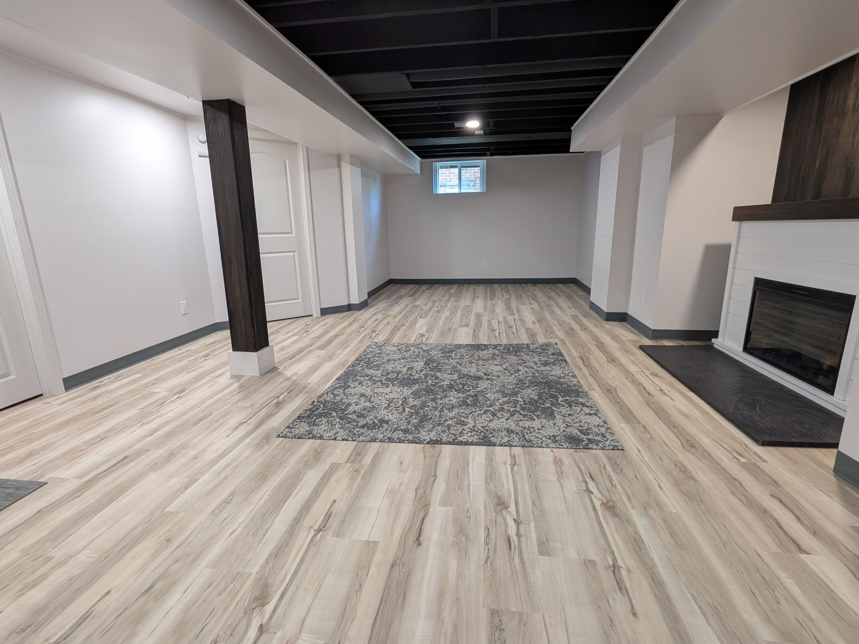 3298 Ridge Road Highland, IN 46322 - Photo 33 of 39 an empty room with wooden floor and fireplace
