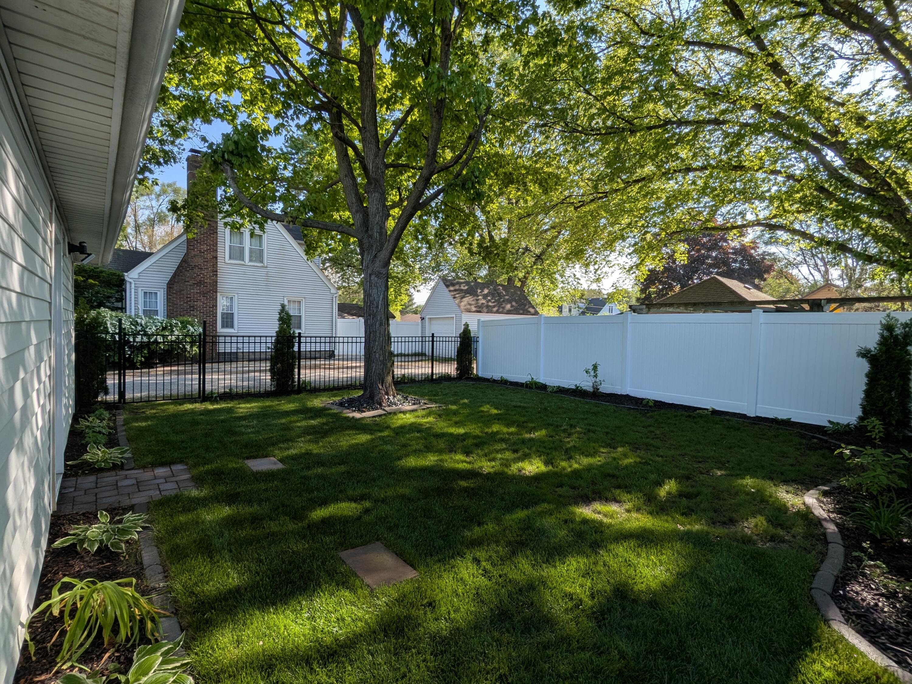 3298 Ridge Road Highland, IN 46322 - Photo 37 of 39 a backyard of a house with lots of green space