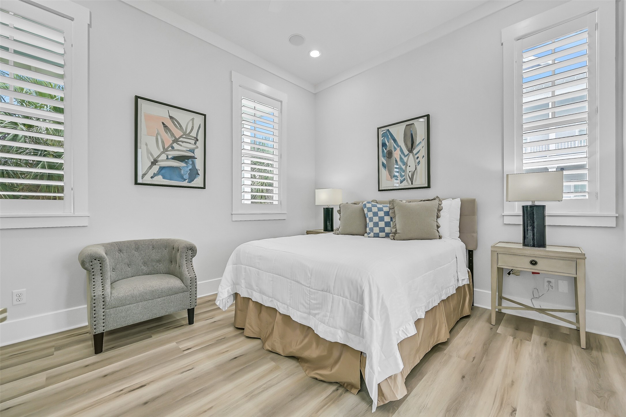 817 Positano Road Galveston, TX 77550 - Photo 33 of 50 Designed for comfort and relaxation, this thoughtfully updated guest room offers a bright coastal ambiance and stylish furnishings. Every detail contributes to the home's fresh, elevated Beachtown aesthetic.