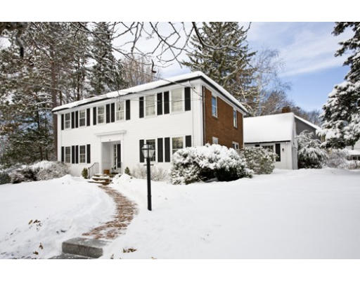 54 Kirkstall Road Newton, MA 02460 - Photo 1 of 4 a view of a white house with snow on the road