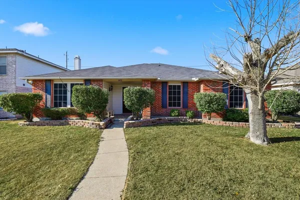 a view of a house with backyard porch and sitting area