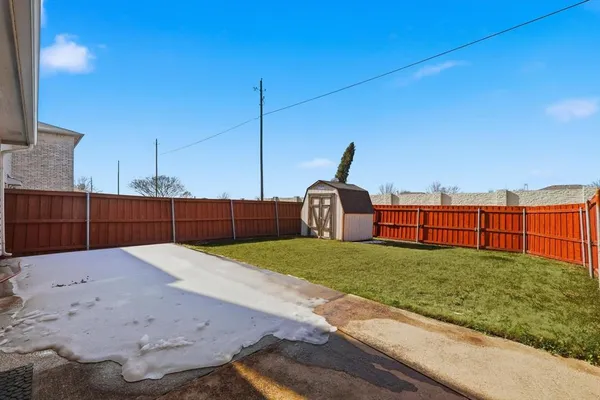 a view of a car parked in front of a house