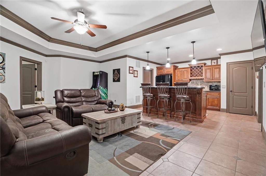 8340 Colonial Place Duluth, GA 30097 - Photo 42 of 74 a living room with lots of furniture and kitchen view