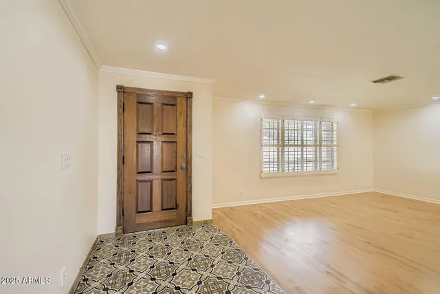 a view of an empty room with a window