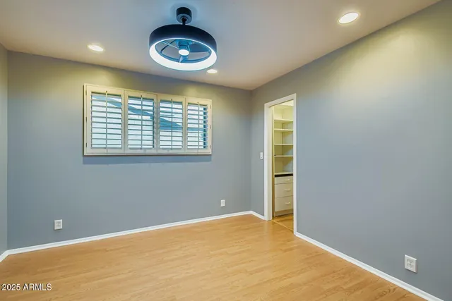 a view of an empty room with a window