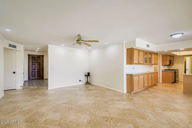 a view of a kitchen with a sink and cabinets