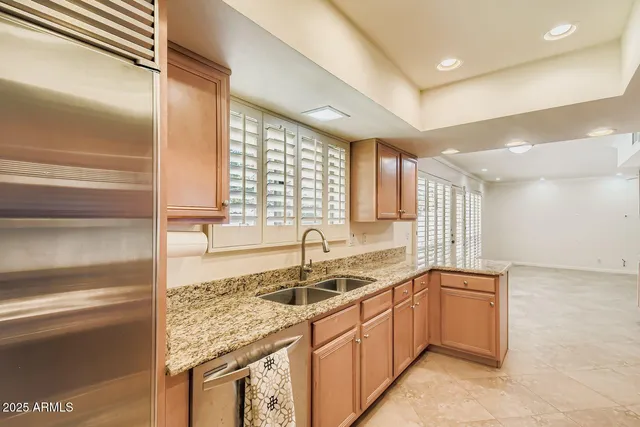 a kitchen with a sink cabinets and window