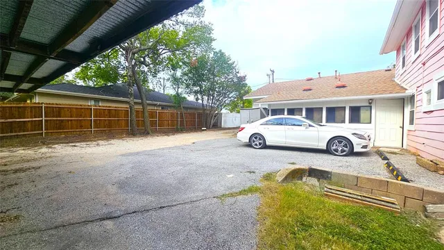 a car parked in front of a house