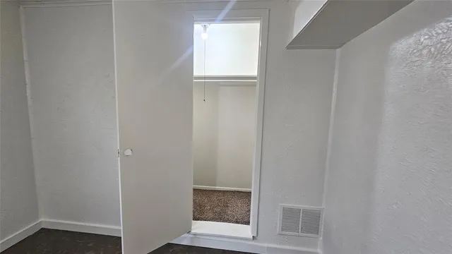 a white toilet sitting next to a sink