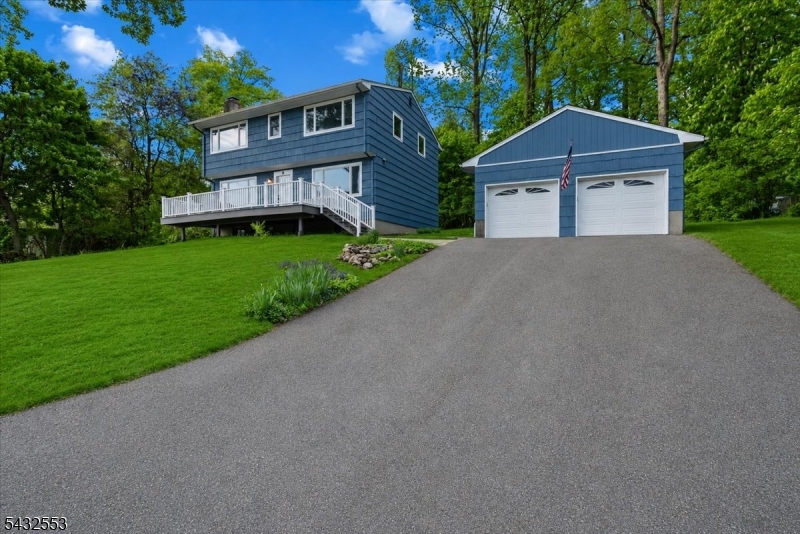 8 Cove Road Hopatcong, NJ 07843 - Photo 1 of 38 a front view of a house with a yard and garage