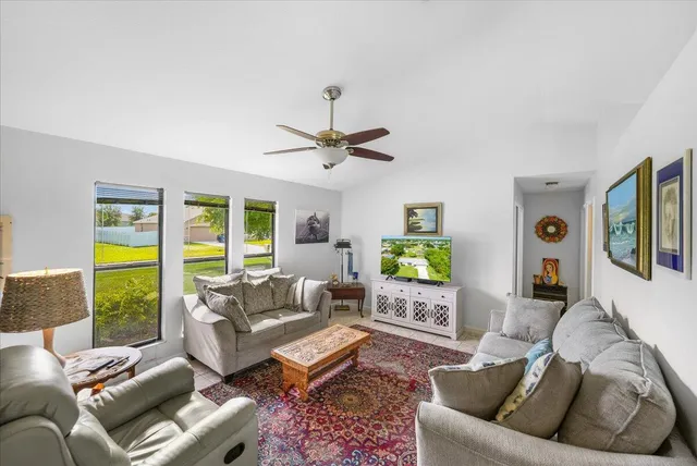 a living room with furniture and a large window