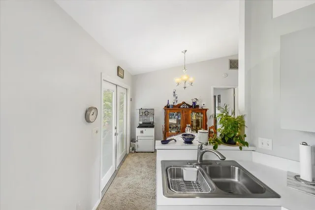 a view of living room kitchen