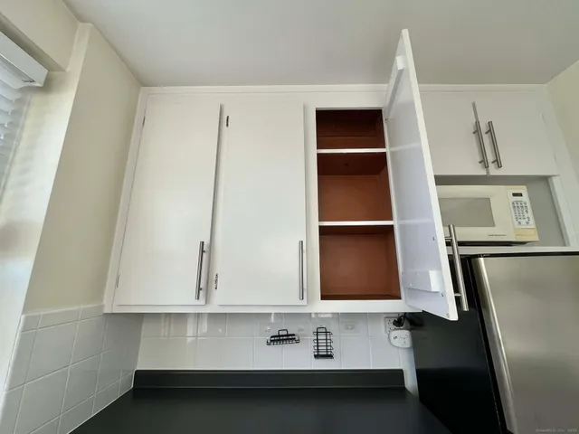 a room with a sink and cabinets