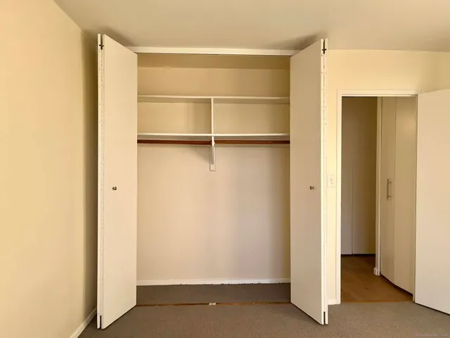 a bathroom with a toilet and a bath tub
