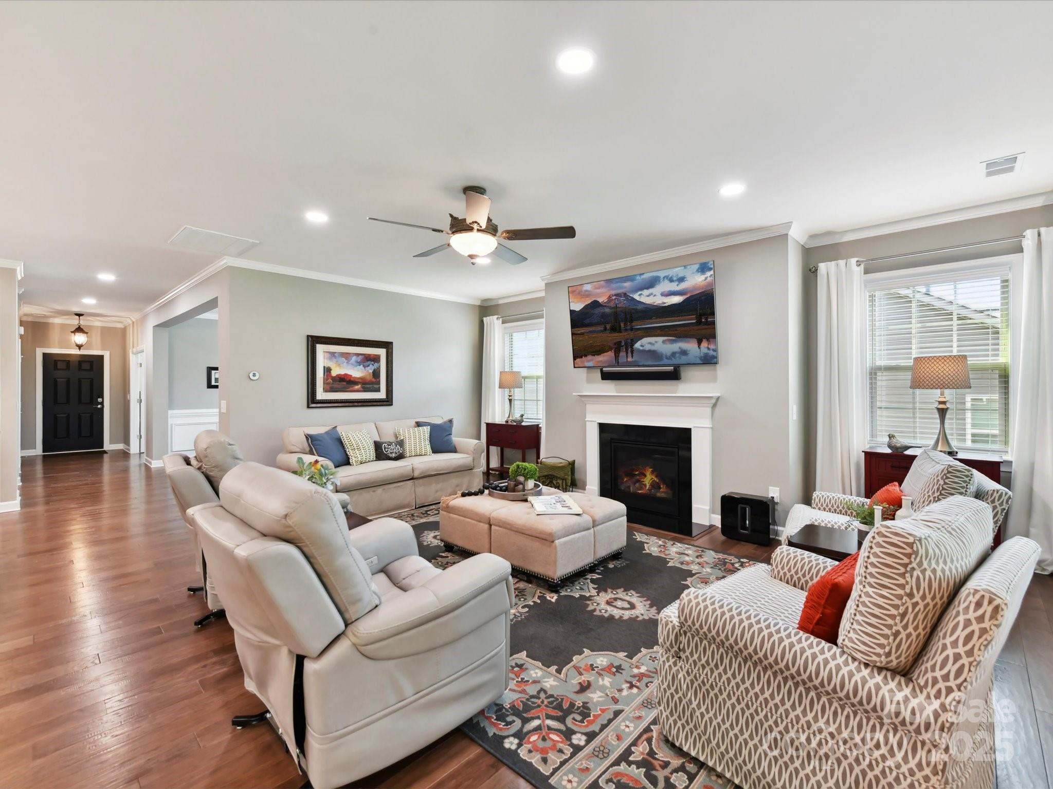 2972 Arches Bluff Circle Lancaster, SC 29720 - Photo 11 of 47 a living room with furniture a fireplace and a flat screen tv