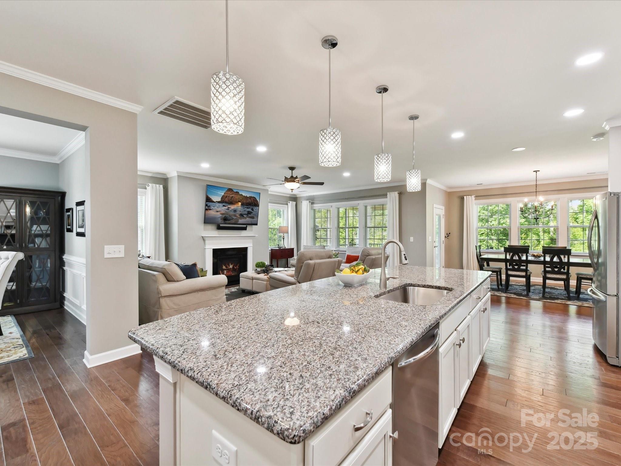 2972 Arches Bluff Circle Lancaster, SC 29720 - Photo 16 of 47 a large kitchen with granite countertop a large island in the center