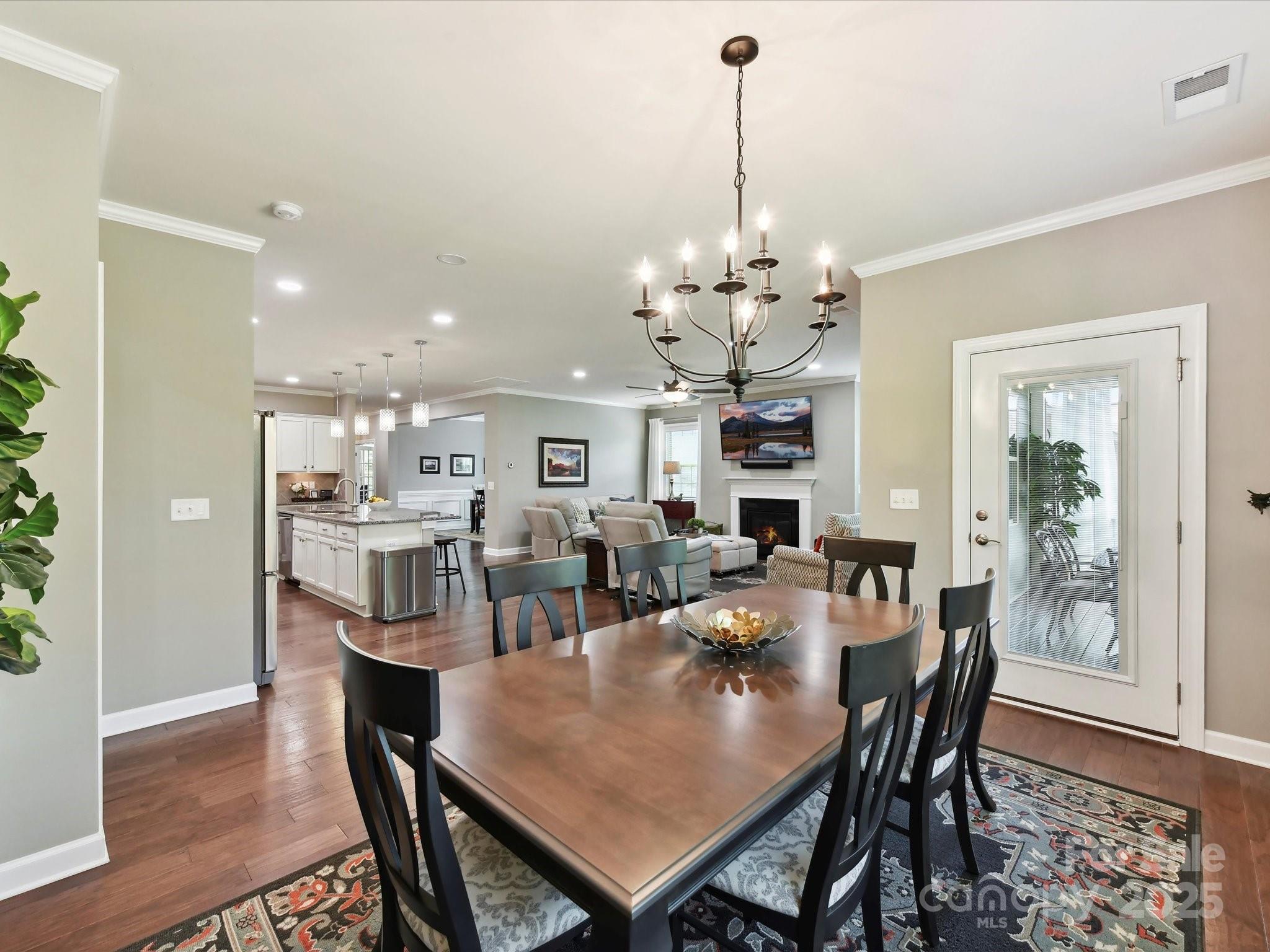 2972 Arches Bluff Circle Lancaster, SC 29720 - Photo 18 of 47 a view of a dining room and livingroom view kitchen with a table and chairs