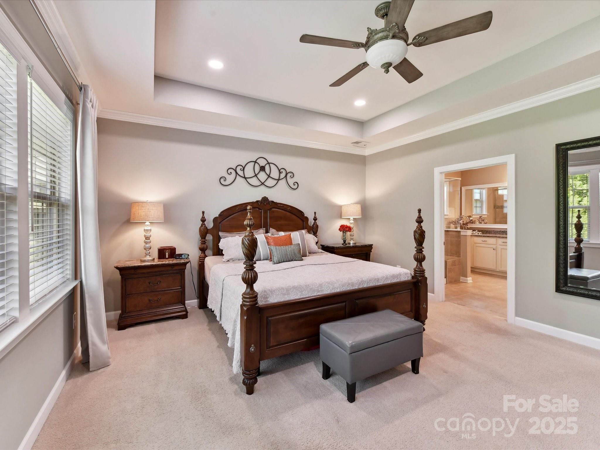 2972 Arches Bluff Circle Lancaster, SC 29720 - Photo 20 of 47 a spacious bedroom with a bed and a chandelier