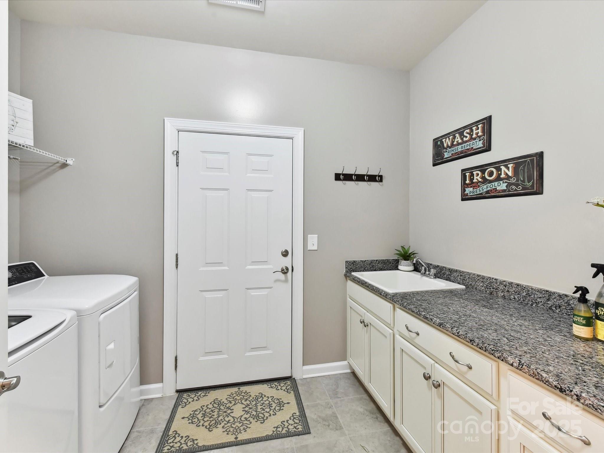 2972 Arches Bluff Circle Lancaster, SC 29720 - Photo 24 of 47 a bathroom with a granite countertop sink and a toilet