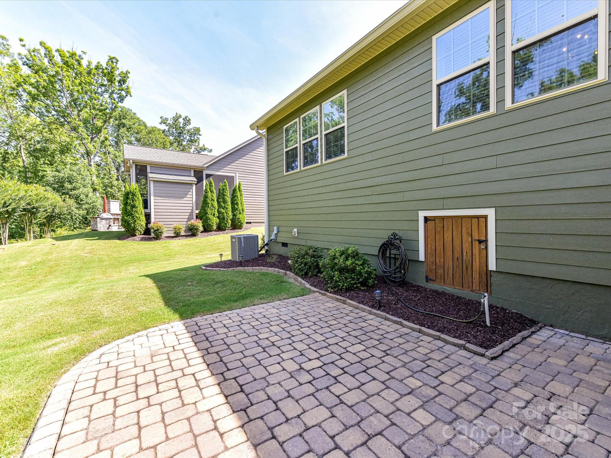 2972 Arches Bluff Circle Lancaster, SC 29720 - Photo 31 of 47 a backyard of a house with yard and outdoor seating