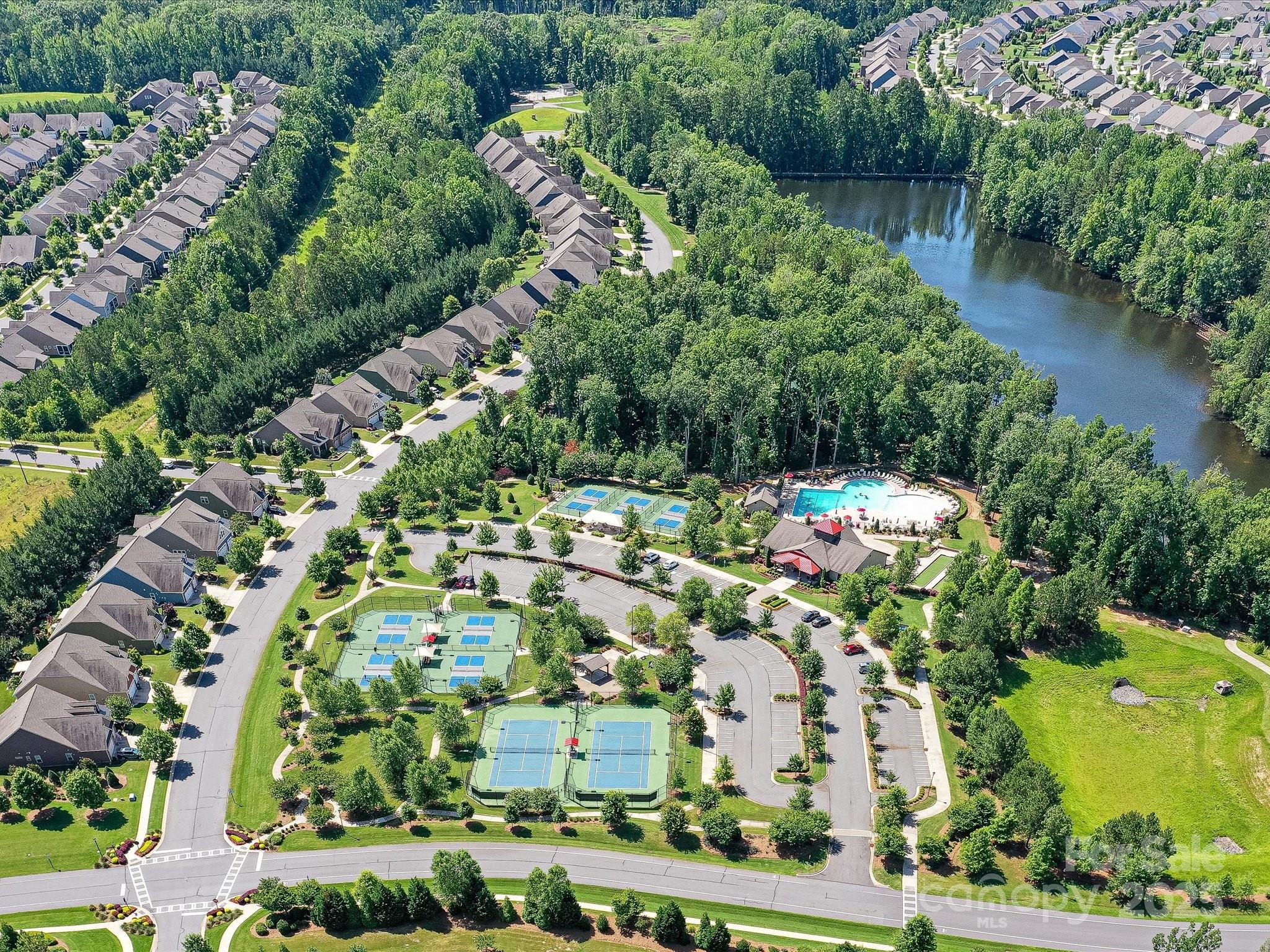 2972 Arches Bluff Circle Lancaster, SC 29720 - Photo 39 of 47 an aerial view of residential houses with outdoor space and trees all around