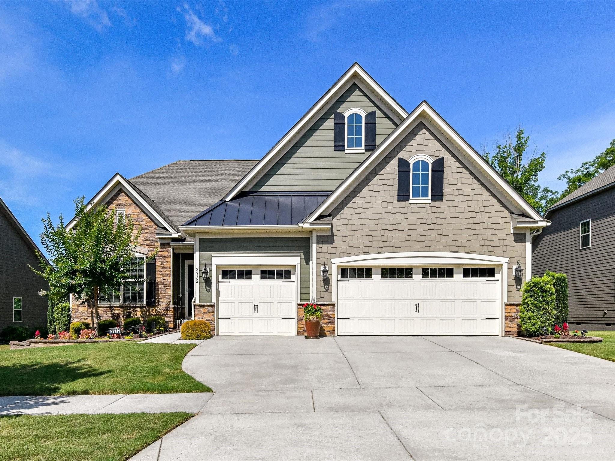2972 Arches Bluff Circle Lancaster, SC 29720 - Photo 47 of 47 a view of a white house with a yard and plants